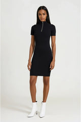 Woman wearing a black dress with a zipper on a white background