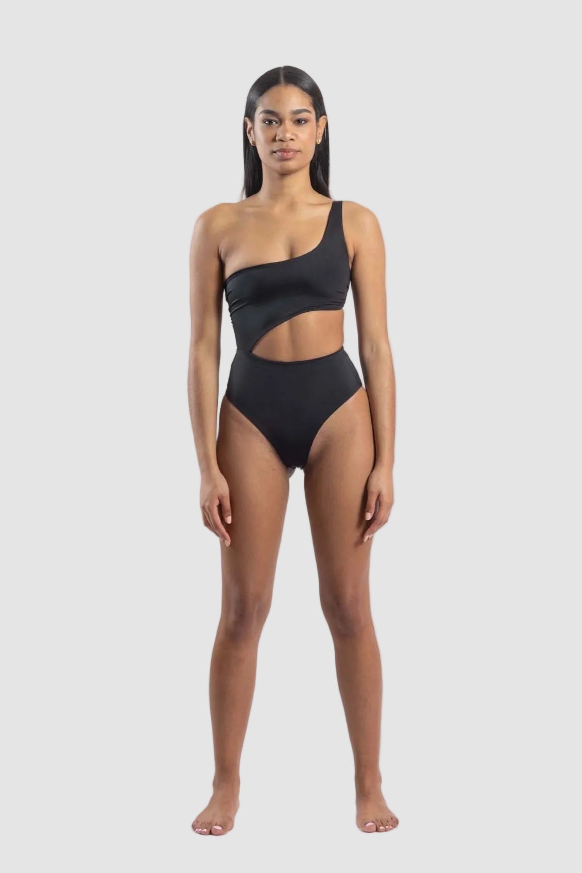 Woman wearing a black swimsuit on a white background