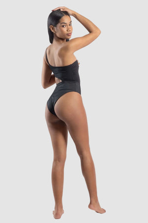 Woman wearing a black swimsuit on a white background