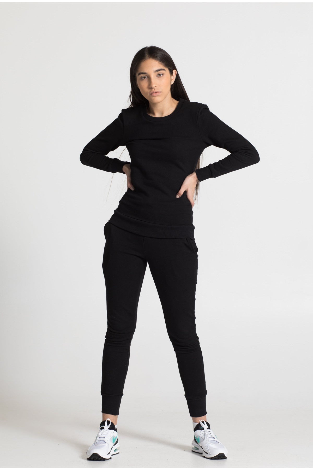 Model in black cotton sweatpant, frontview