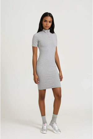 Woman wearing a gray dress on a white background