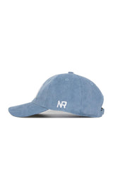 Designed by No Rivals, the Texas A&M Corduroy Hat from the Spring Showers Collection features an unstructured 6-panel style in sky blue corduroy. "NR" is embroidered in white on the side, and the cap is displayed in a left side profile view against a white background. An adjustable strap ensures a comfortable fit.
