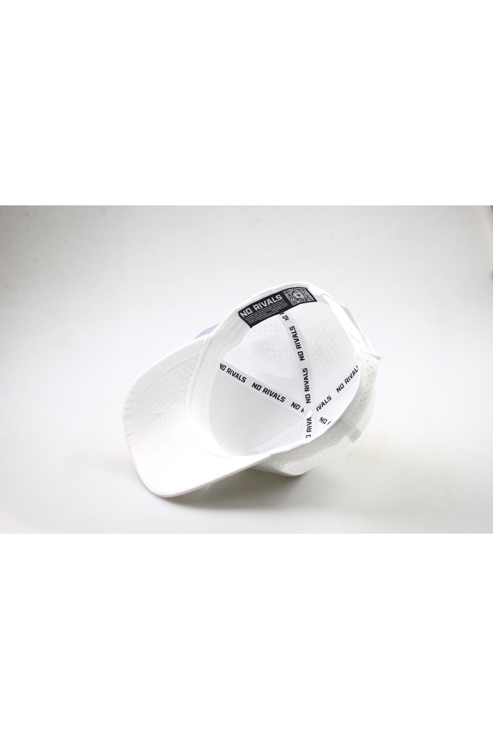The Costal Carolina University Gameday Hat is shown upside down on a white surface, revealing inside bands with repeated black NO RIVALS text. The plain background highlights this stylish snap back—perfect for your gameday fit.
