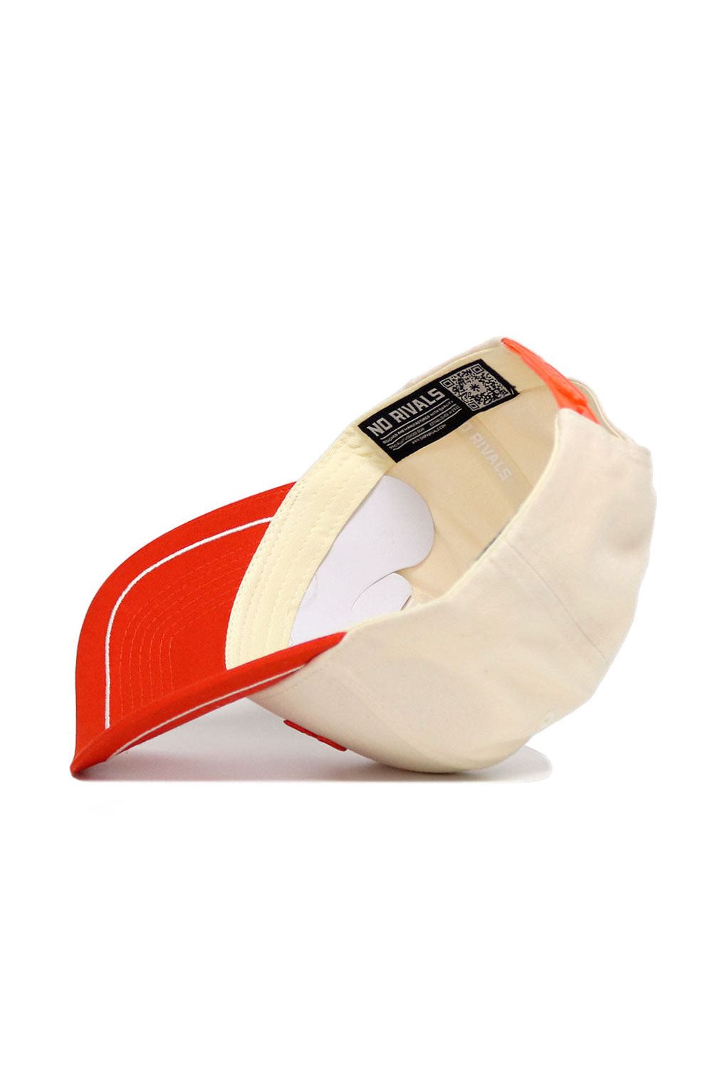 The OSU Pokes ALOYO Hat (B2B) by No Rivals is a cream and red structured-fit cap. Shown upside down, its inside label displays "NO RIVALS" and a QR code near the rim. Made from quality cotton, the red brim has white stitching.