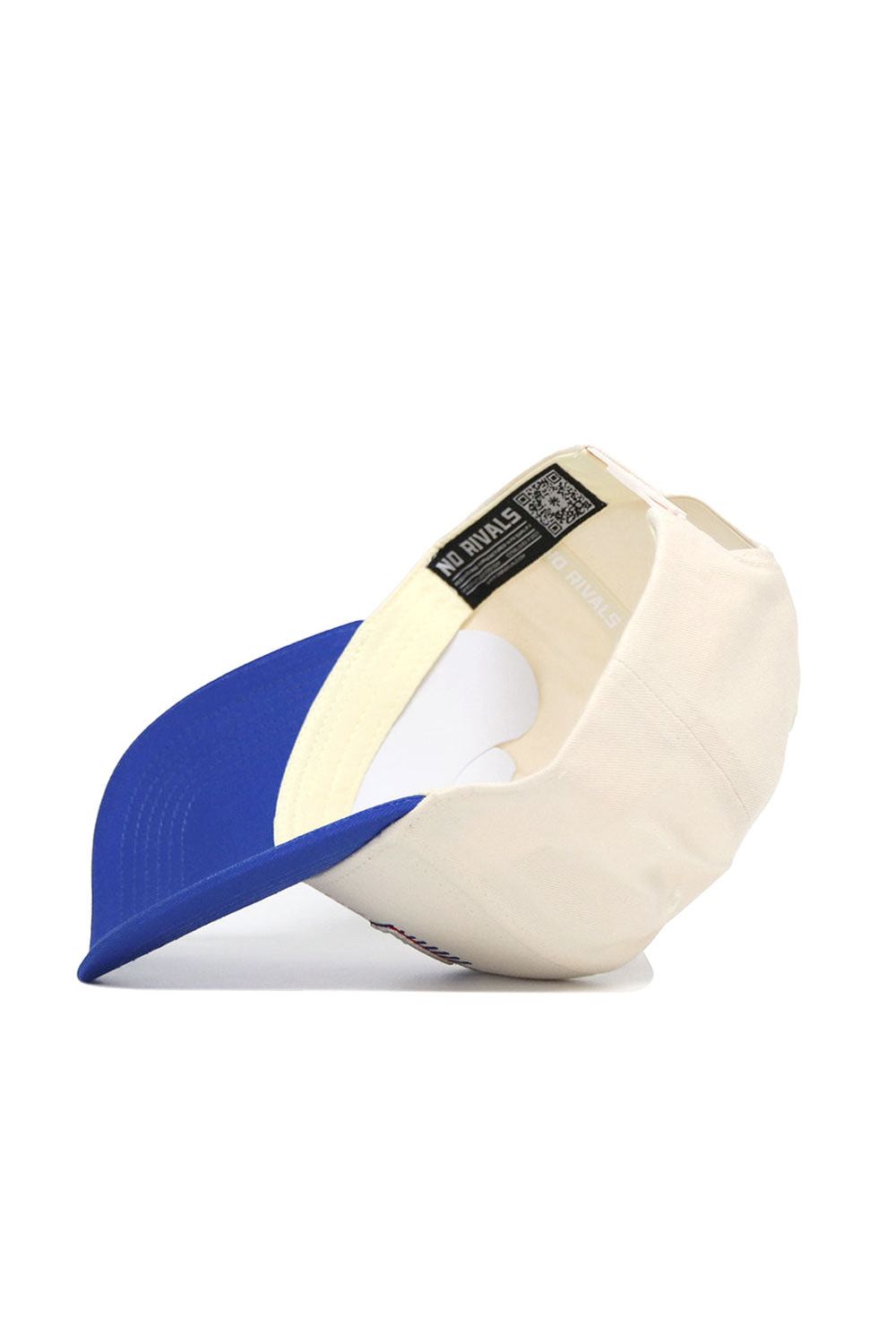 The LA Tech Triangle Game Cap Hat by No Rivals is displayed sideways, showing the cream cap with blue brim, inside tags, and adjustable strap. "NO RIVALS" appears on the inner band, emphasizing its structured fit and lasting comfort.