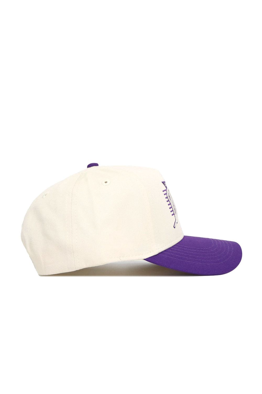 The No Rivals JMU Triangle Game Cap Hat is a cream-colored snapback with a purple brim, side view. Made of premium cotton, it has a structured fit, ventilation eyelets, and an embroidered front design.