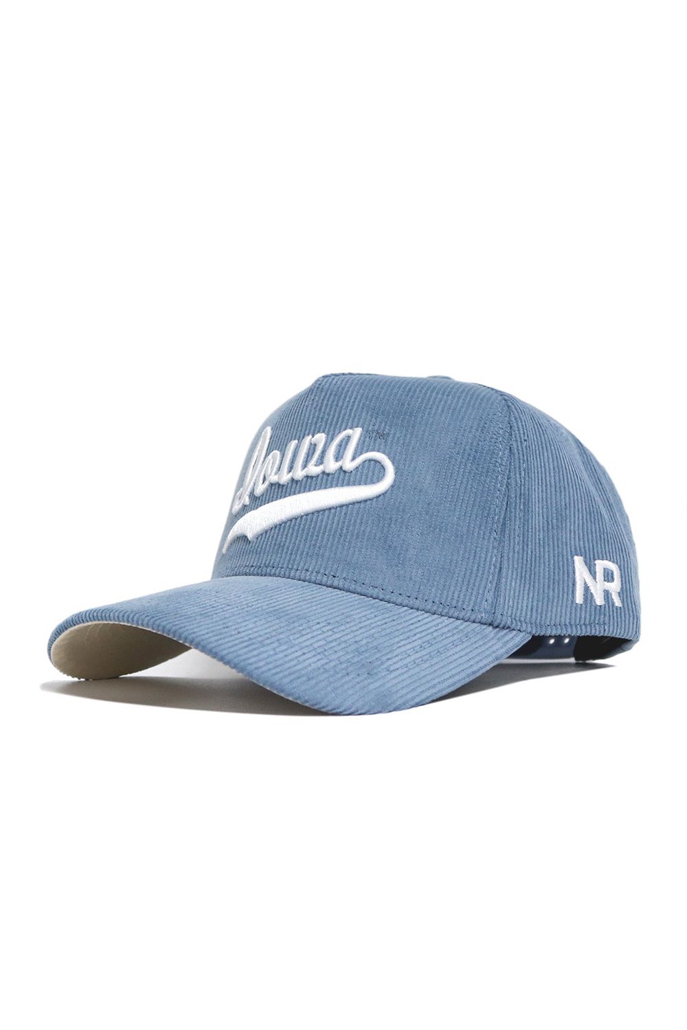The Iowa Corduroy Hat by No Rivals features sky blue corduroy, "Iowa" embroidered in white on the front, "NR" stitched on the side, a curved brim, structured fit, and an adjustable strap at the back.
