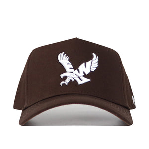 The No Rivals EWU Americano Hat is a brown snapback made from high-quality cotton, featuring a white embroidered eagle with outstretched wings on the front for a structured fit.