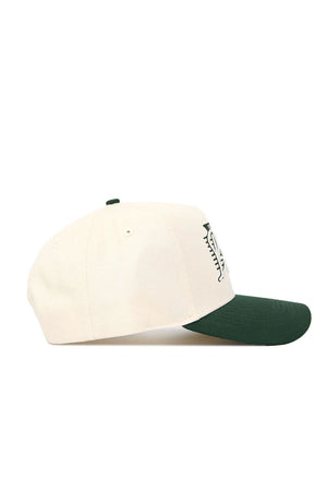 The Baylor Triangle Game Cap Hat by No Rivals is a cream-colored baseball cap with a dark green curved brim, shown from the side. This snapback features part of a front-panel graphic or logo.