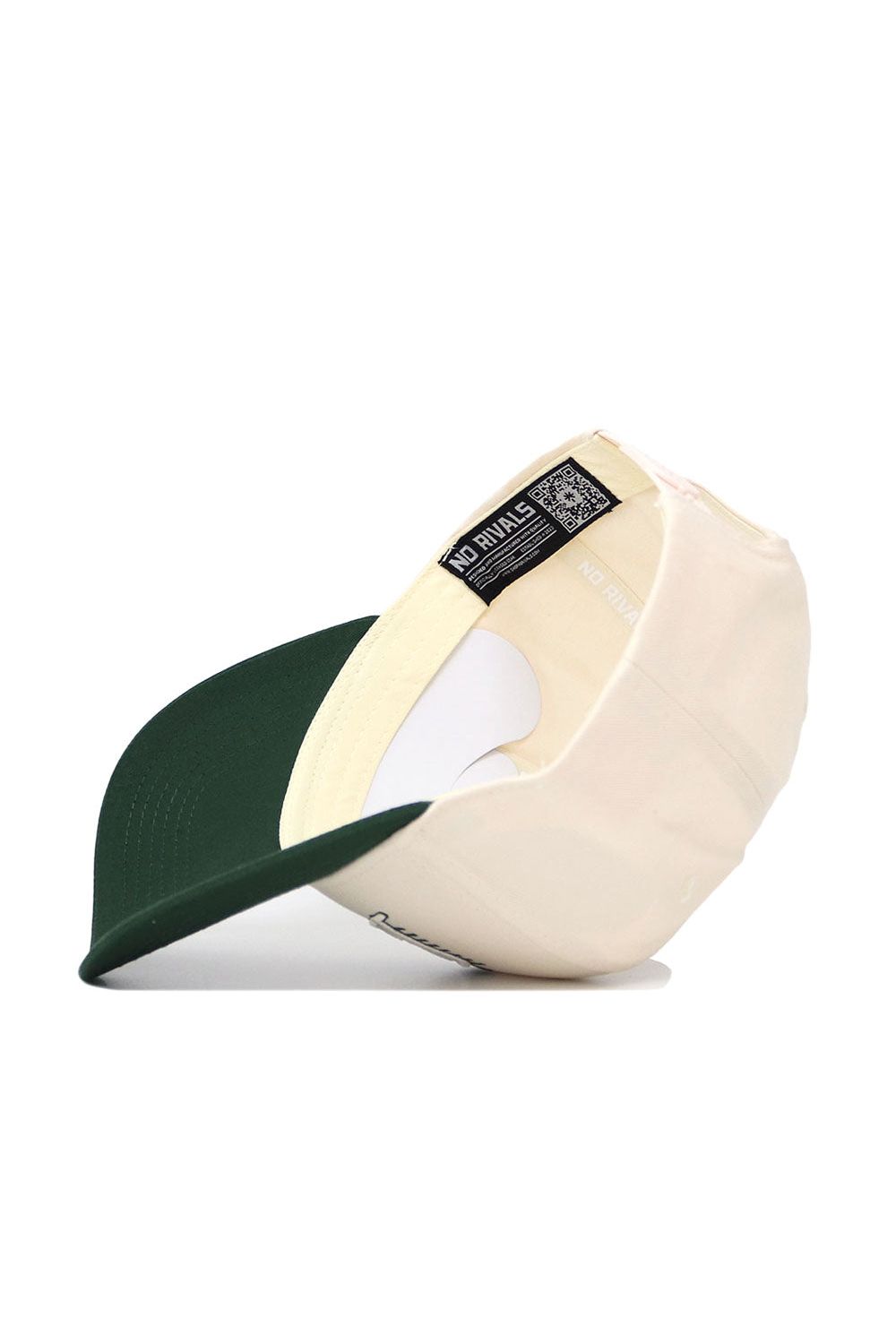 The Baylor Triangle Game Cap Hat by No Rivals is shown upside down, displaying the inside crown, underside brim, a label reading "NO RIVALS," and a QR code on the lining. The cap features a structured fit in beige and dark green.