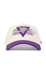 The Kansas State Triangle Game Cap Hat by No Rivals is a cream-colored, structured cotton snapback with a purple brim and Kansas State University embroidered in purple and white on the front.