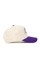 The No Rivals Kansas State Triangle Game Cap Hat is a cream structured fit cotton cap with a purple brim and purple embroidered front design, shown from the side on a white background.