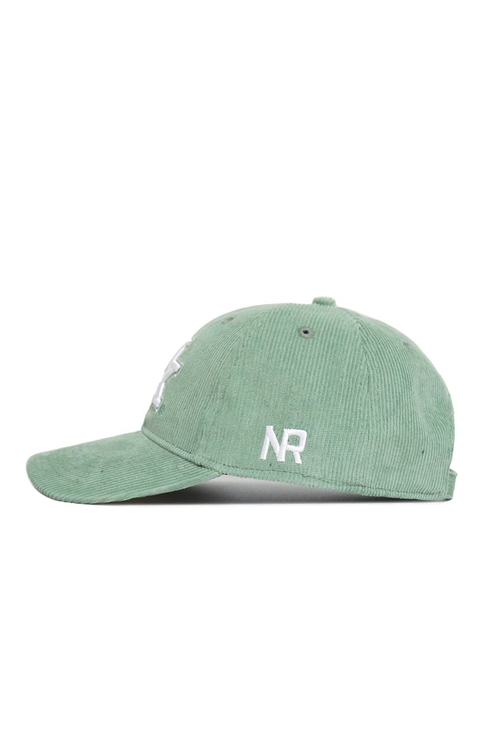 The No Rivals Kentucky Corduroy Hat - Unstructured - Spring Green (B2B) is a sage green 6-panel hat with side white NR embroidery, ventilation eyelets, and an adjustable strap for comfort.