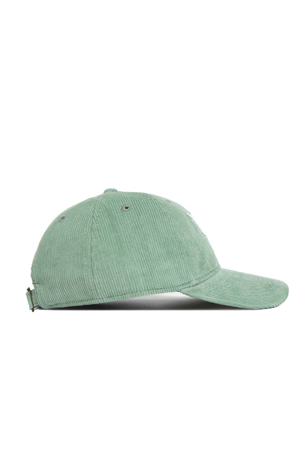 The No Rivals Kentucky Corduroy Hat – Unstructured in Spring Green (B2B) features a 6-panel design, curved brim, and adjustable back strap, shown here in a light green side profile view.