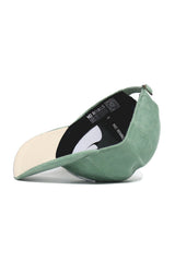 The No Rivals Kentucky Corduroy Hat - Unstructured - Spring Green (B2B) is shown from the side, brim forward, displaying the black NO RIVALS interior band and QR code on the inner lining.