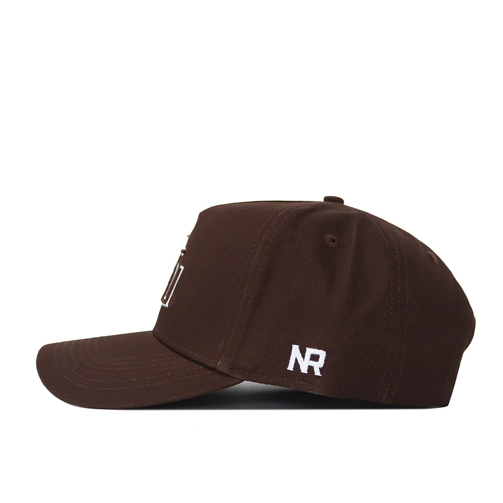 The Florida State Americano Hat (B2B) is shown in a side view. This brown, high-quality cotton baseball cap features white NR embroidery near the back, a structured fit, curved brim, and ventilation eyelets on top.