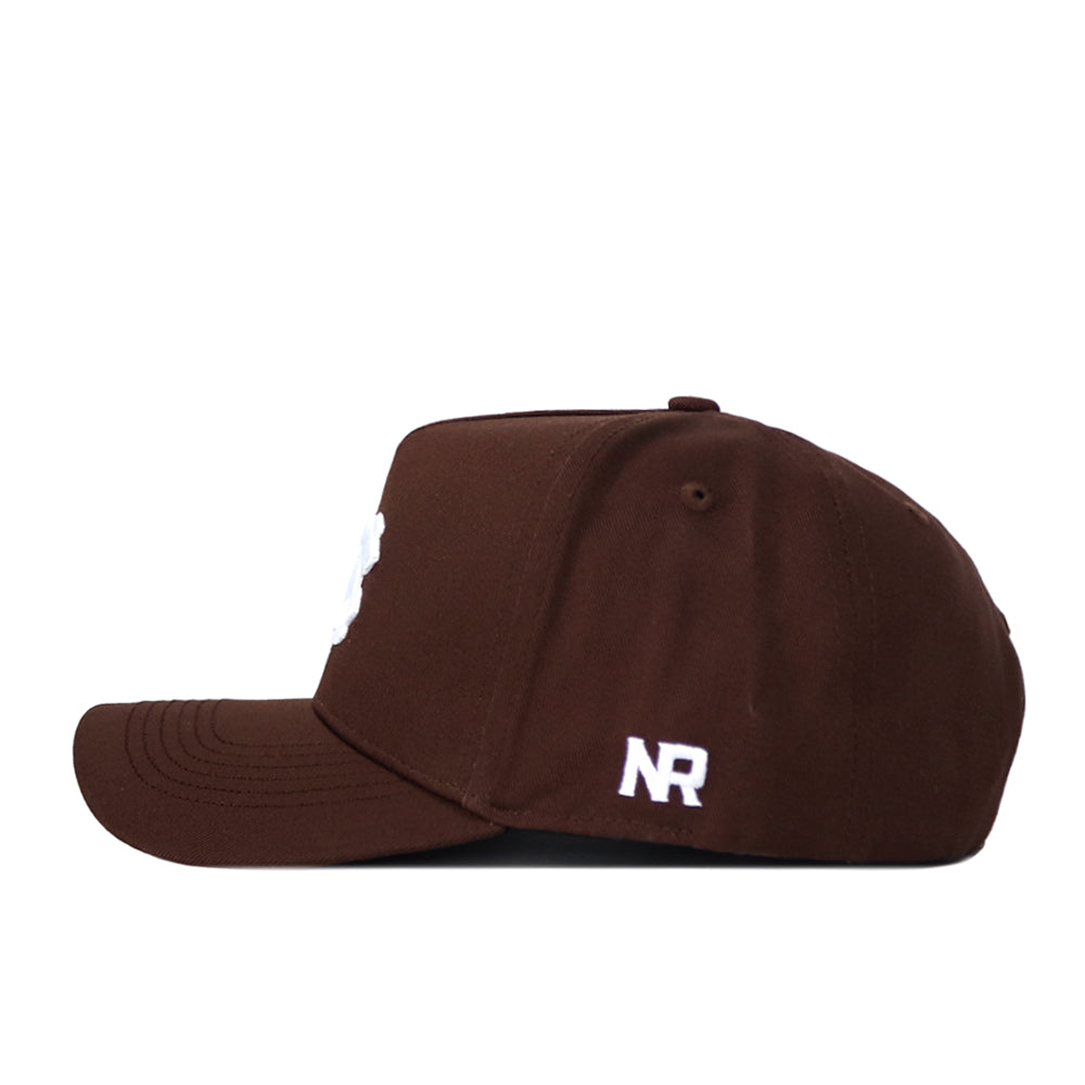 The North Carolina (UNC) Americano Hat (B2B) is a brown snapback with white embroidered NR on the back, a structured fit, and visible brim stitching, viewed from the side.