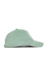 The No Rivals Iowa Corduroy Hat from the Spring Showers Collection is shown in spring green, featuring an unstructured 6-panel design with a curved brim, ventilation eyelets, and an adjustable strap at the back.
