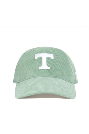 The No Rivals Tennessee Corduroy Hat - Unstructured in Spring Green features a large white "T" embroidered on the front. This 6-panel cap is displayed face forward against a white background.