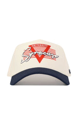 The Syracuse Triangle Game Cap Hat by No Rivals is a white snapback with a navy brim, “Syracuse” in script, “University” in block letters, and a red triangle with horizontal red lines. Offers a structured fit.