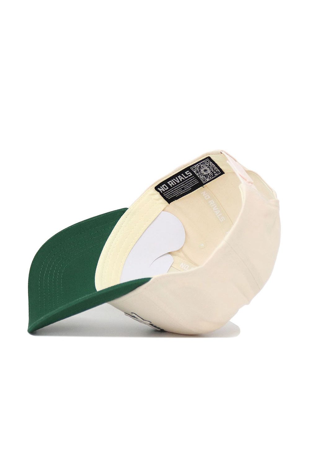 A Hawai'i Triangle Game Cap Hat by No Rivals is flipped upside down, showing the inside label with "NO RIVALS" and a QR code. The structured snapback features a green brim and beige panels, displayed on a white surface.