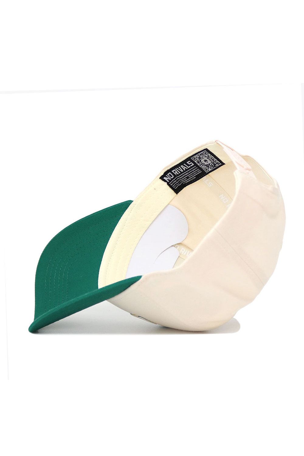 The No Rivals NDSU Triangle Game Cap Hat is shown inside-out on a white background, highlighting its structured fit, interior labels, stitching, and sweatband. This cream cap with a green brim is made from high-quality cotton and features an adjustable snapback.
