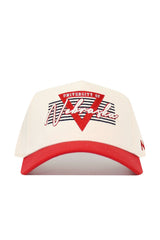 The No Rivals Nebraska Triangle Game Cap Hat features a cream snapback design with a red brim, red and white University of Nebraska text, a red triangle, black stripes, and is made from high-quality cotton for a comfortable, structured fit.