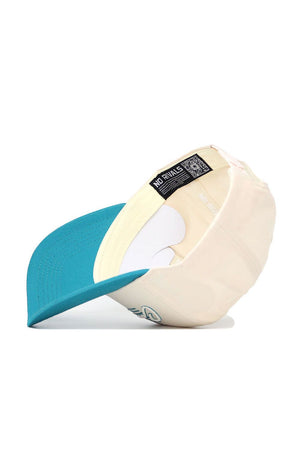 The Coastal Carolina Triangle Game Cap Hat by No Rivals is shown upside down, highlighting its inside NO RIVALS label. It features a teal brim, cream crown, and structured fit for lasting style.
