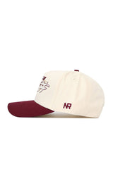 The No Rivals Texas State Triangle Game Cap Hat features a cream snapback design with a maroon brim, embroidered maroon and gold front logo, NR initials on the side, and high-quality cotton for structured comfort.