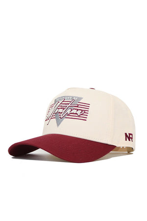The Montana University Triangle Game Cap Hat by No Rivals features a cream color, structured fit, maroon curved brim, “University of Victory” embroidered on the front, and “NR” initials stitched on the left side—perfect for fans.