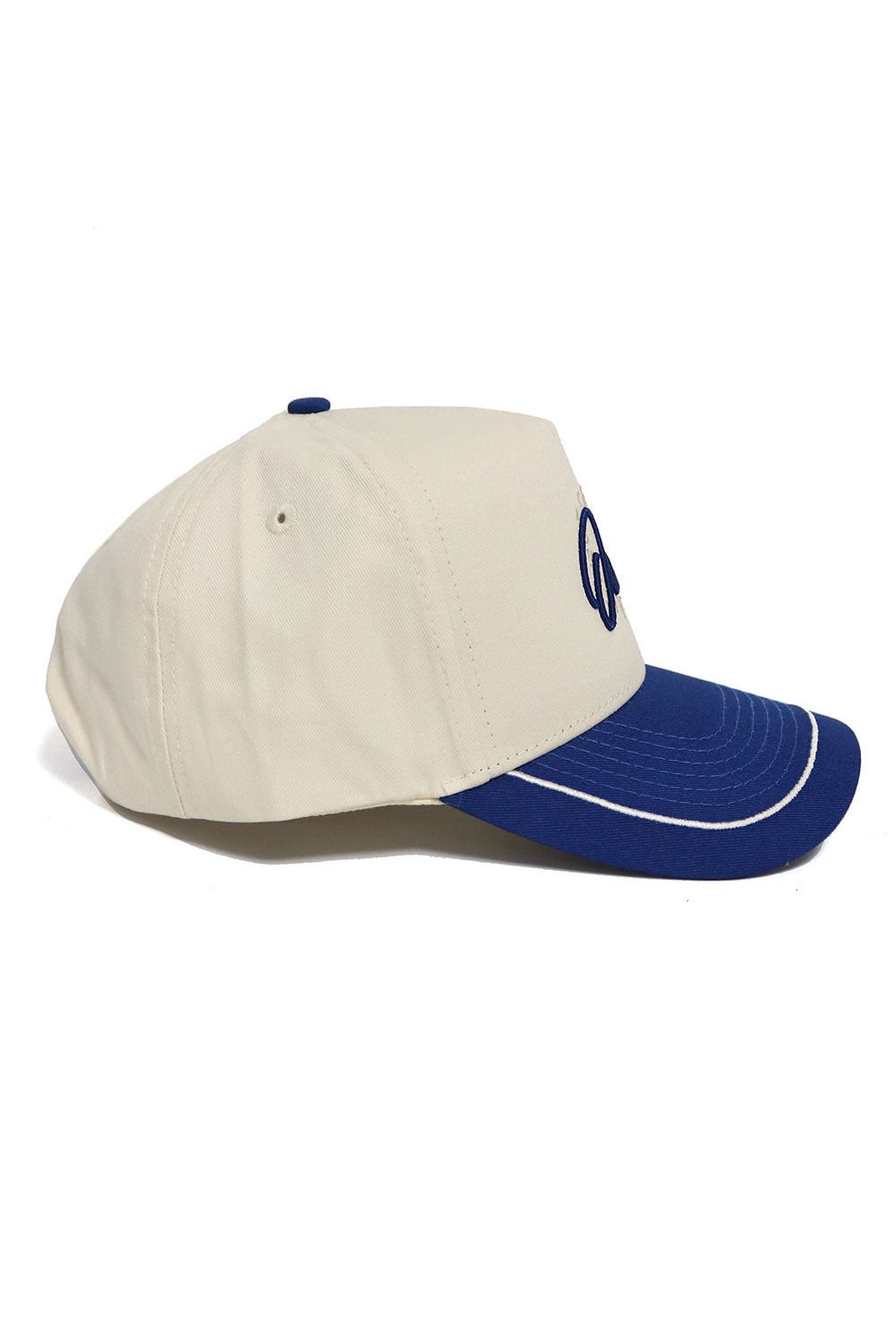 The Rice Owls ALOYO Hat by No Rivals is a cream-colored, structured-fit cap with a blue brim, blue stitching, and front blue embroidery. Made of high-quality cotton, it’s shown in a side view for a stylish look.