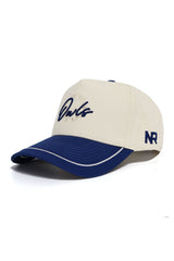 A cream-colored snapback hat with a blue curved brim, white trim, and blue embroidery. The front features "Rice Owls" in script, with "NR" stitched on the side. No Rivals brand. Rice Owls ALOYO Hat made from high quality cotton for comfort.