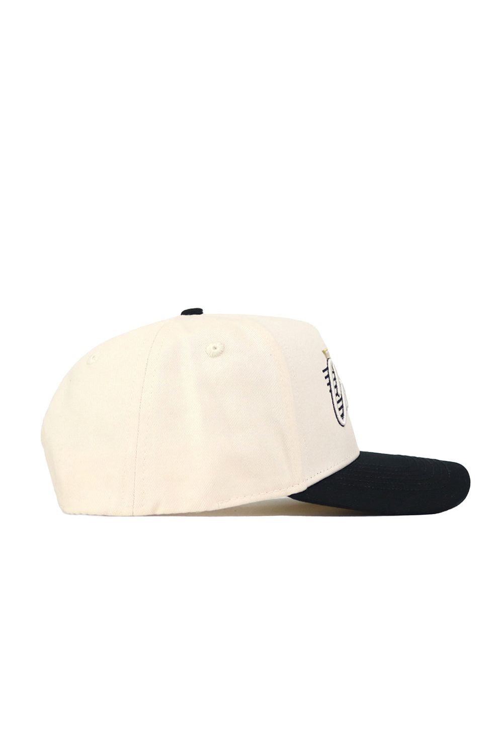 The Colorado Triangle Game Cap Hat is a cream-colored baseball cap with a black brim and structured fit, viewed from the side. A small embroidered design appears on the front panel near the brim.