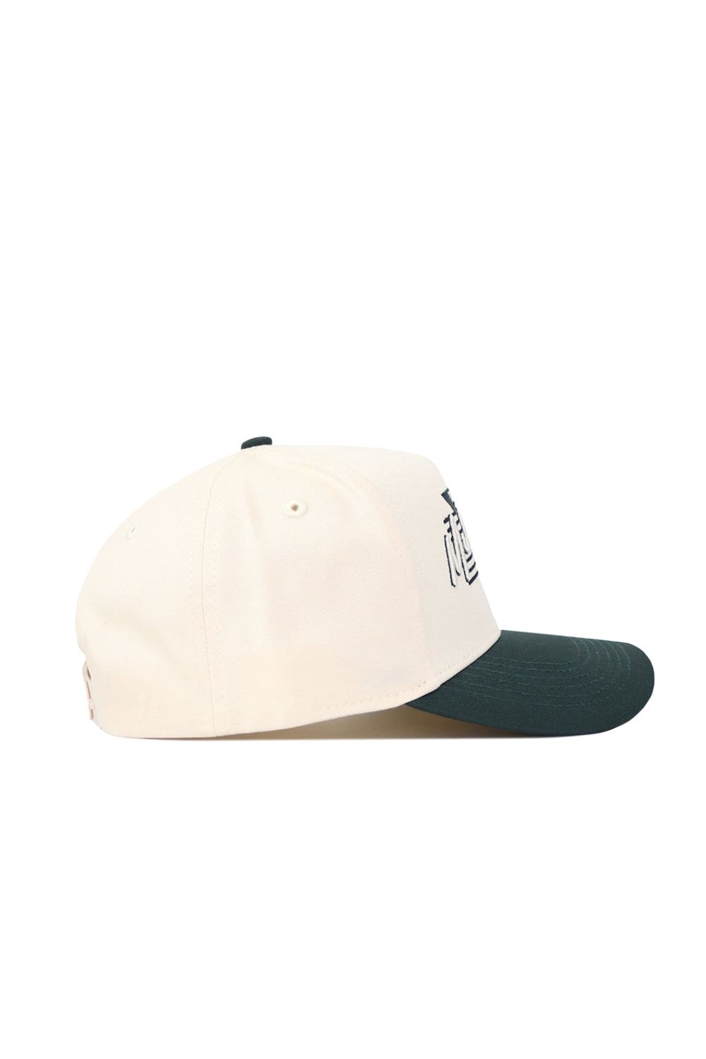 The No Rivals Michigan State Triangle Game Cap Hat is cream with a dark green brim, shown from the side. This structured fit features partial embroidered lettering on the front and a classic snapback closure.