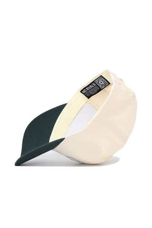 The Michigan State Triangle Game Cap Hat by No Rivals is shown upside down, revealing its inside label with a QR code. This structured beige and dark green cap features a curved bill and an adjustable snap back for comfort.