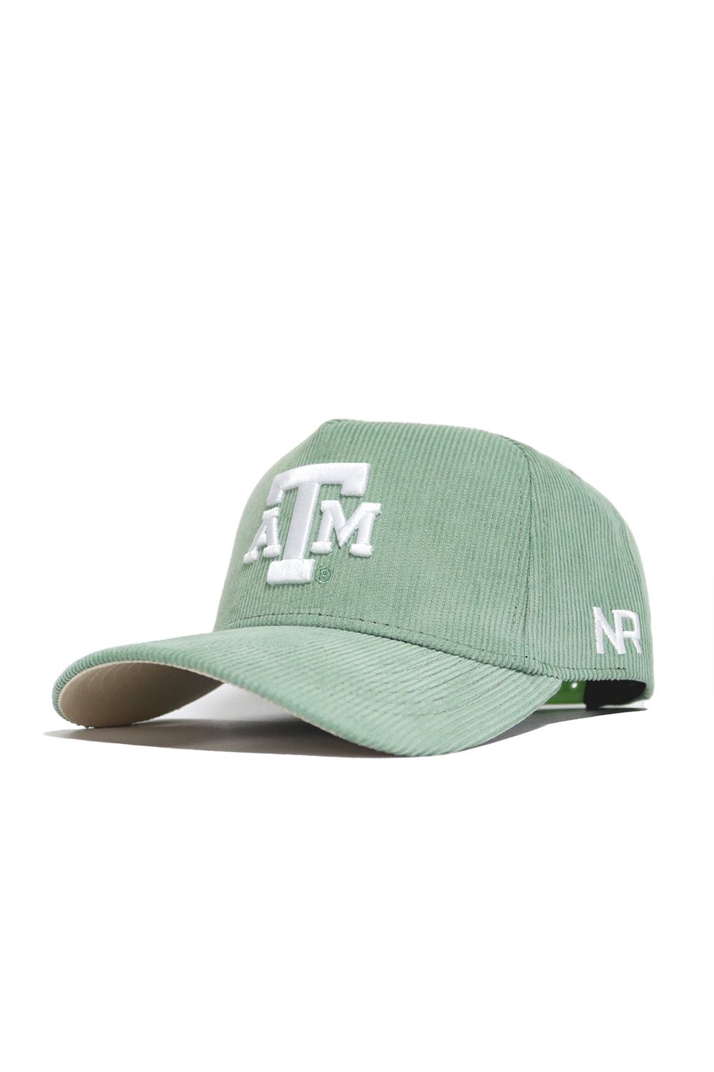 The No Rivals Texas A&M Corduroy Hat in spring green features a white embroidered ATM logo on the front, NR initials on the side, a curved brim, visible stitching, and a structured fit for lasting comfort.