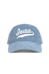 Introducing the Iowa Corduroy Hat - Unstructured - Sky Blue from No Rivals’ Spring Showers Collection. This light blue, unstructured 6-panel cap features "Iowa" embroidered in white script on the front, and is displayed facing forward against a plain white background. An adjustable strap ensures a comfortable fit.