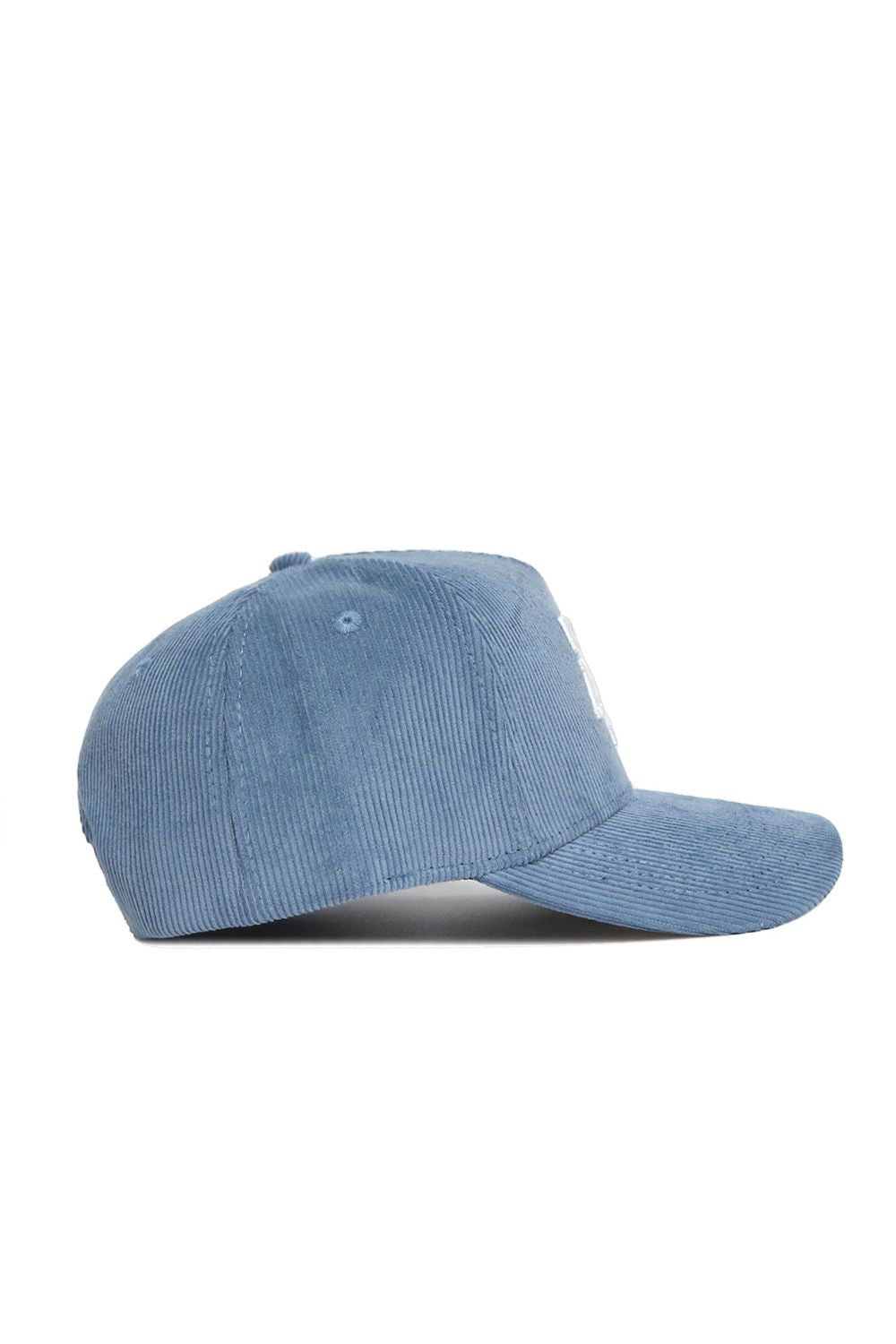 The Texas A&M Corduroy Hat by No Rivals in sky blue is a structured snapback with a curved brim and top button, shown from the side.
