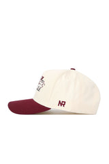 The No Rivals New Mexico State Triangle Game Cap Hat features a cream snapback, maroon brim, side NR initials embroidery, and a partially visible maroon and white front logo in a structured fit.
