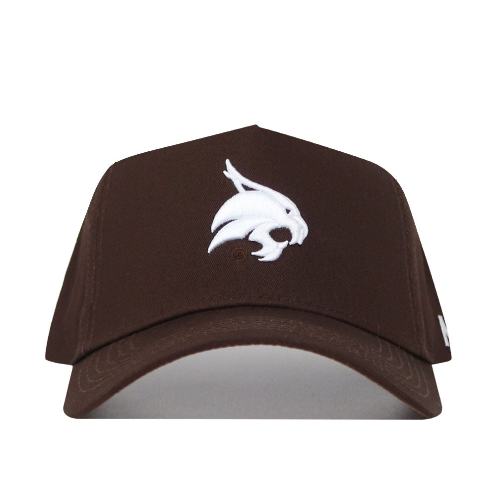 The Texas State Americano Hat is a brown snapback cap with a white embroidered stylized bobcat head on the front panel, made from high-quality cotton for a structured fit.