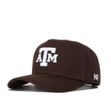 The Texas A&M Americano Hat is a brown cotton baseball cap with white embroidered ATM letters on the front and a small white N R logo on the side of the bill.