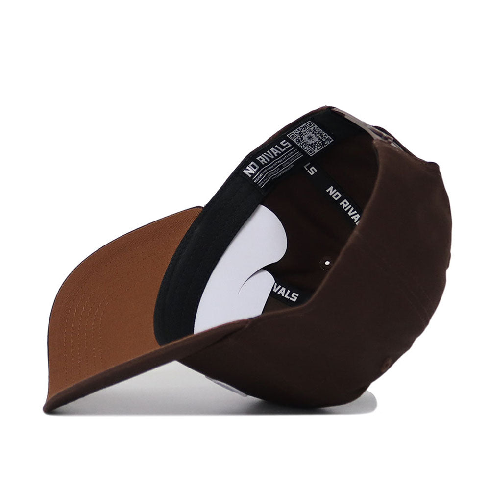 The Ole Miss Americano Hat is a brown baseball cap displayed upside down, revealing a high-quality cotton inner lining and a black headband with NO RIVALS repeated in white.