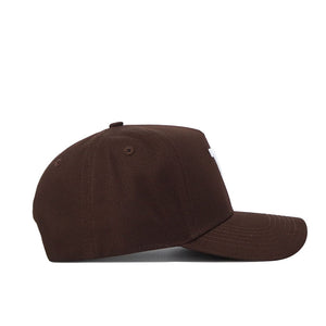 The West Virginia Americano Hat, a plain brown cotton baseball cap with a curved brim and structured fit, is shown from the side on a white background. The cap has no visible logos or designs.