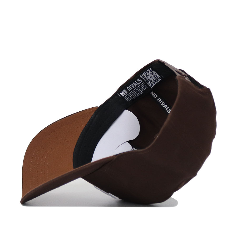 The TCU Americano Hat is a brown structured fit cap shown from the inside, featuring a visible sweatband and brim. “NO RIVALS” is printed in white on the inner band, alongside a QR code.