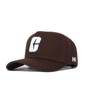 The UNC Charlotte Americano Hat is a brown snapback made from high-quality cotton, featuring a white embroidered C logo on the front and NR stitched in white on the side.
