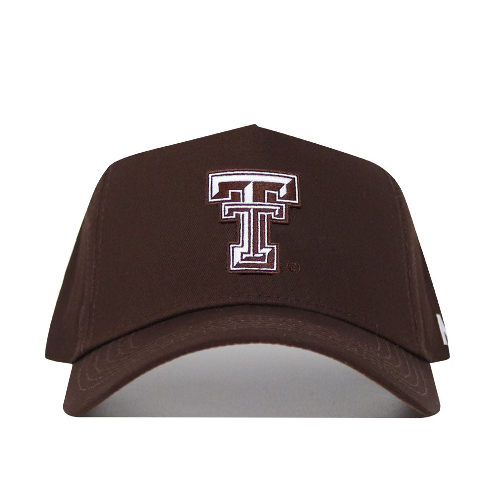 The Texas Tech Americano Hat is a brown, high-quality cotton snapback cap with a large white and maroon Double T logo embroidered on the front. This officially licensed hat is shown against a white background.