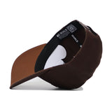 The Texas Tech Americano Hat, made of high quality brown cotton, is shown upside down to display its black interior lining featuring white "NO RIVALS" text around the band.
