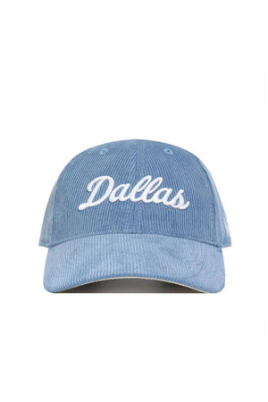 The No Rivals Dallas Corduroy Hat - Unstructured in Sky Blue (B2B) features white "Dallas" cursive embroidery on the front, a 6-panel unstructured design, and an adjustable strap, shown against a white background.