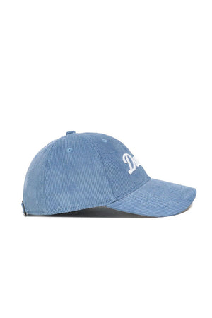 No Rivals Dallas Corduroy Hat in Sky Blue features an unstructured 6-panel design, curved brim, white front embroidery, and adjustable strap. Shown in a side view.