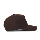 The Western Carolina Americano Hat is displayed from the side, showcasing its structured fit, dark brown color, curved brim, and visible stitching on a white background.